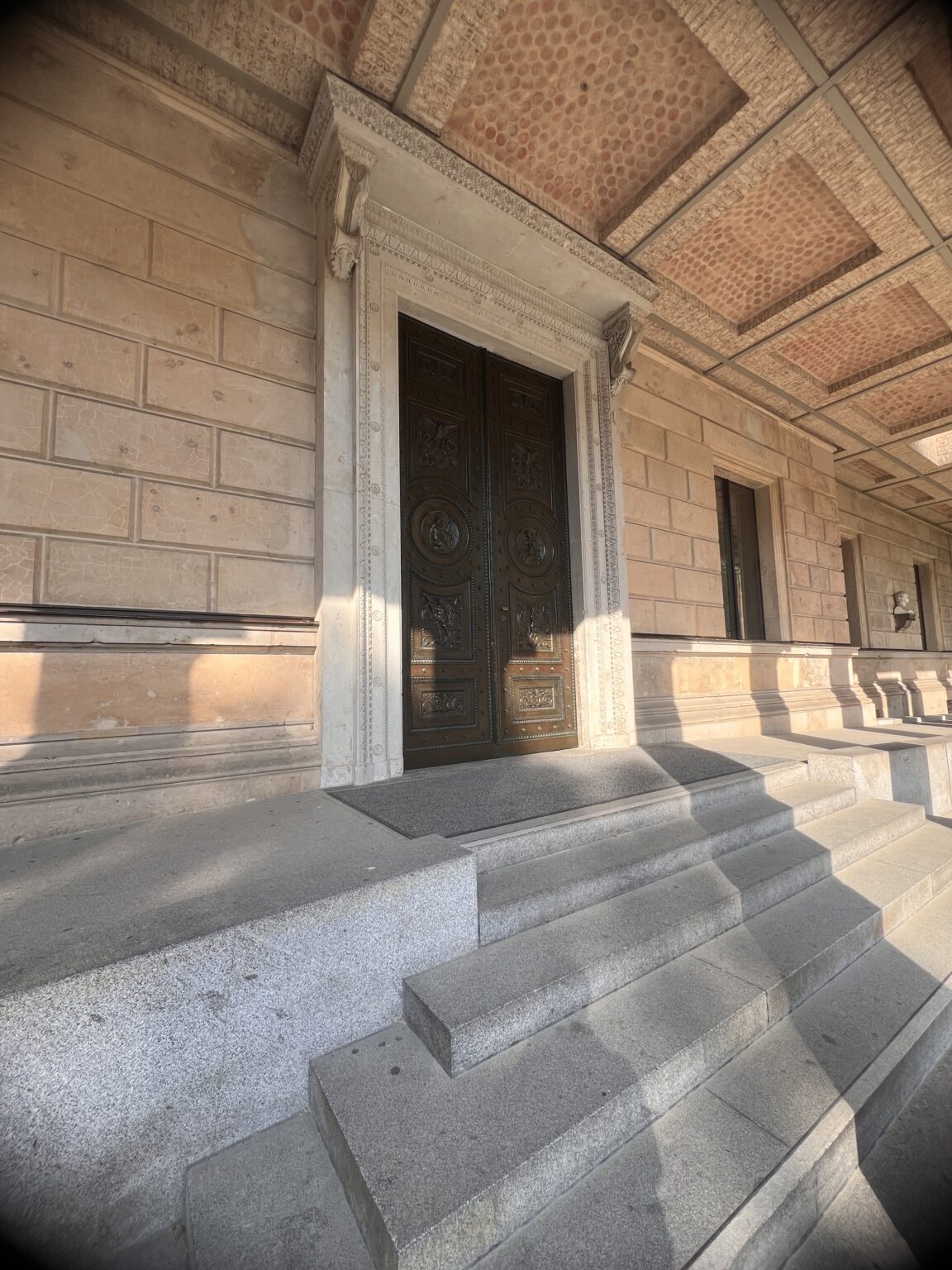 Grand entrance doorway with stone steps at a classical museum building on Berlin's Museum Island